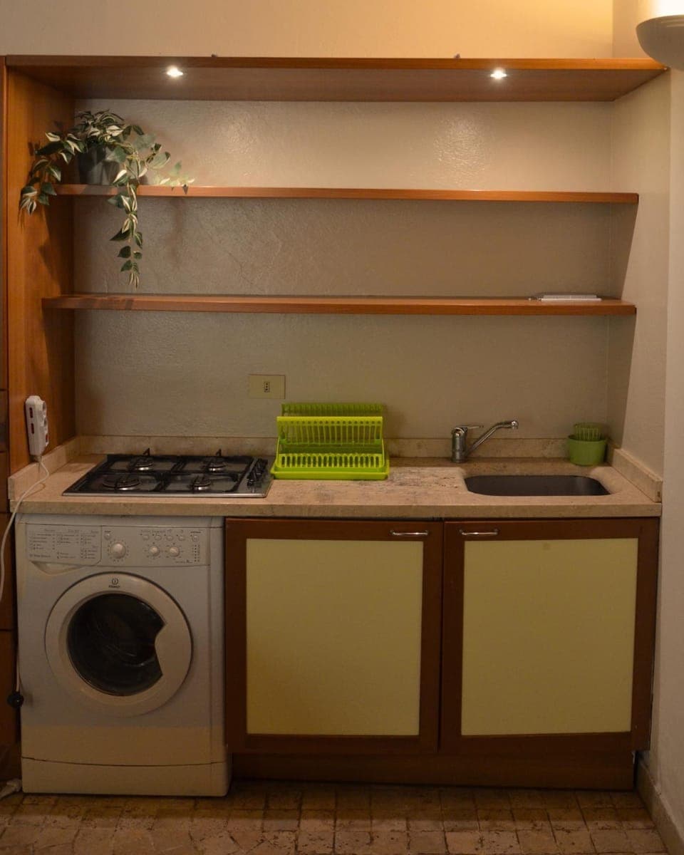 Kitchen or kitchenette, stove, washing machine