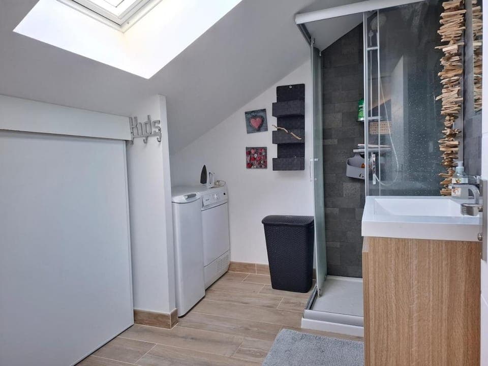 Shower, Bathroom, flat iron, hair dryier, storage, washing machine, dryer