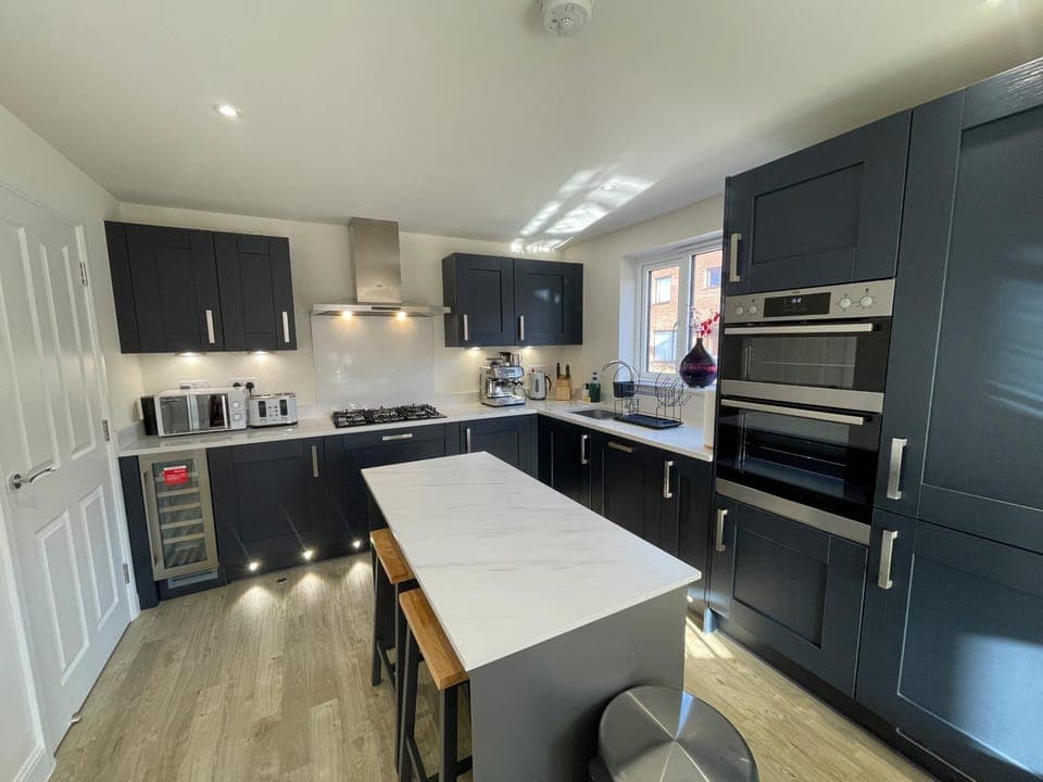 Kitchen or kitchenette, dishwasher, oven, stove, toaster