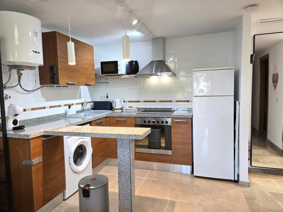 Kitchen or kitchenette, dishwasher, oven, toaster, washing machine