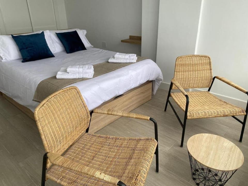 Bed, Seating area, Bedroom