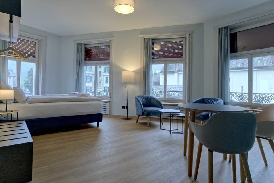 Bed, Living room, Seating area, Dining area