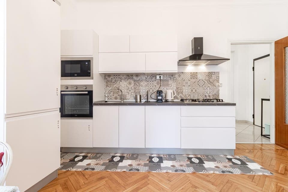 Kitchen or kitchenette, dishwasher, oven, stove