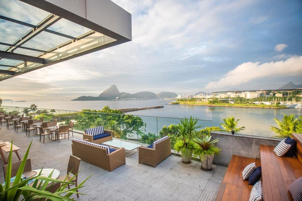 Property building, Nearby landmark, Restaurant/places to eat, Day, Natural landscape, View (from property/room), Balcony/Terrace, Seating area, Sea view