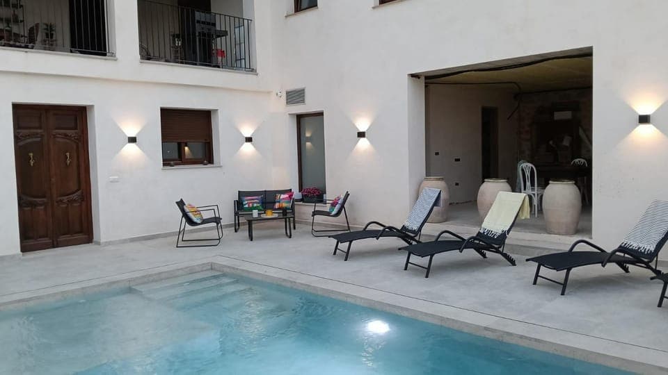 Property building, Living room, Swimming pool