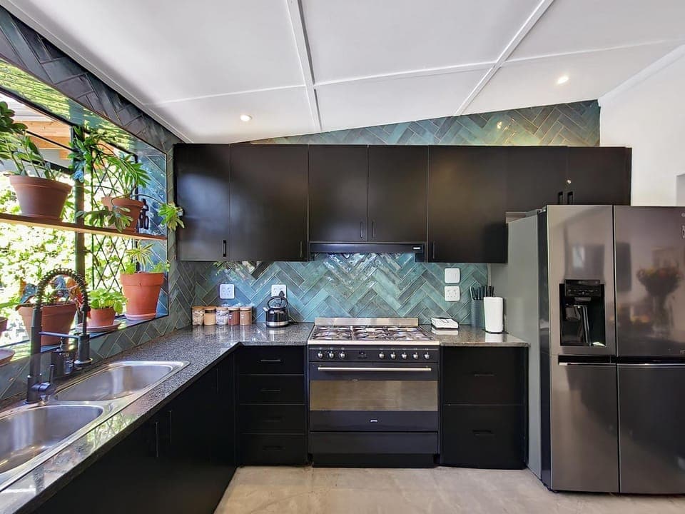 Kitchen or kitchenette, dishwasher, oven, stove