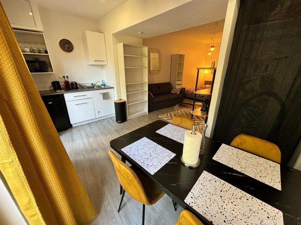 Kitchen or kitchenette, Dining area, microwave, storage, stove