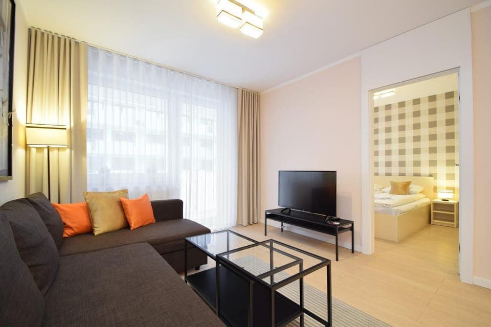 Bed, TV and multimedia, Living room, Seating area, Bedroom