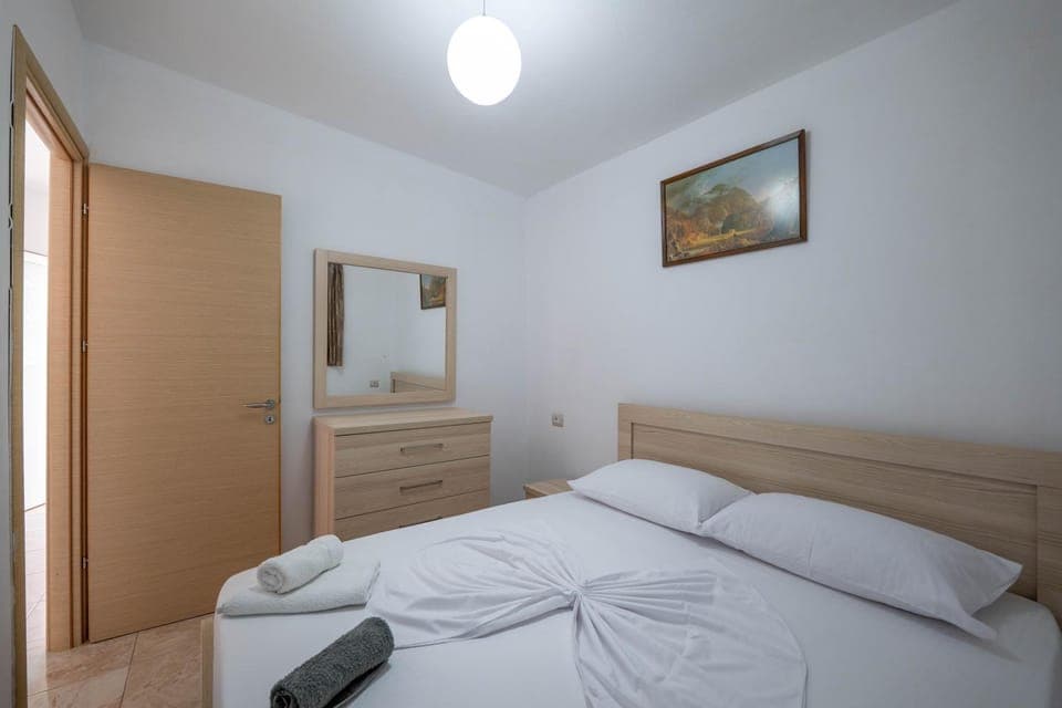 Bed, towels, wardrobe