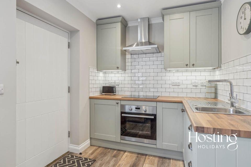 Kitchen or kitchenette, dishwasher, oven, stove