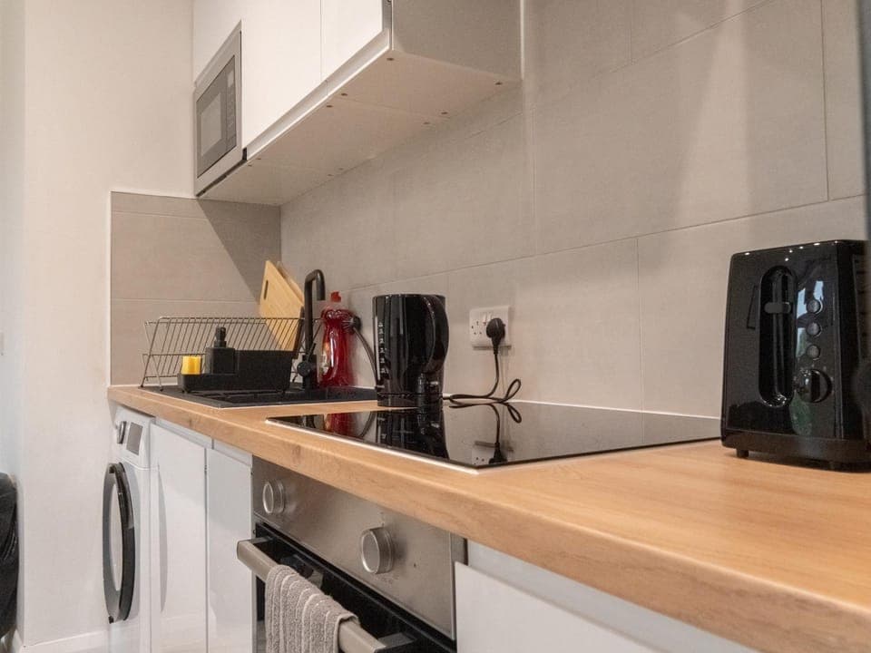 Kitchen or kitchenette, stove, toaster