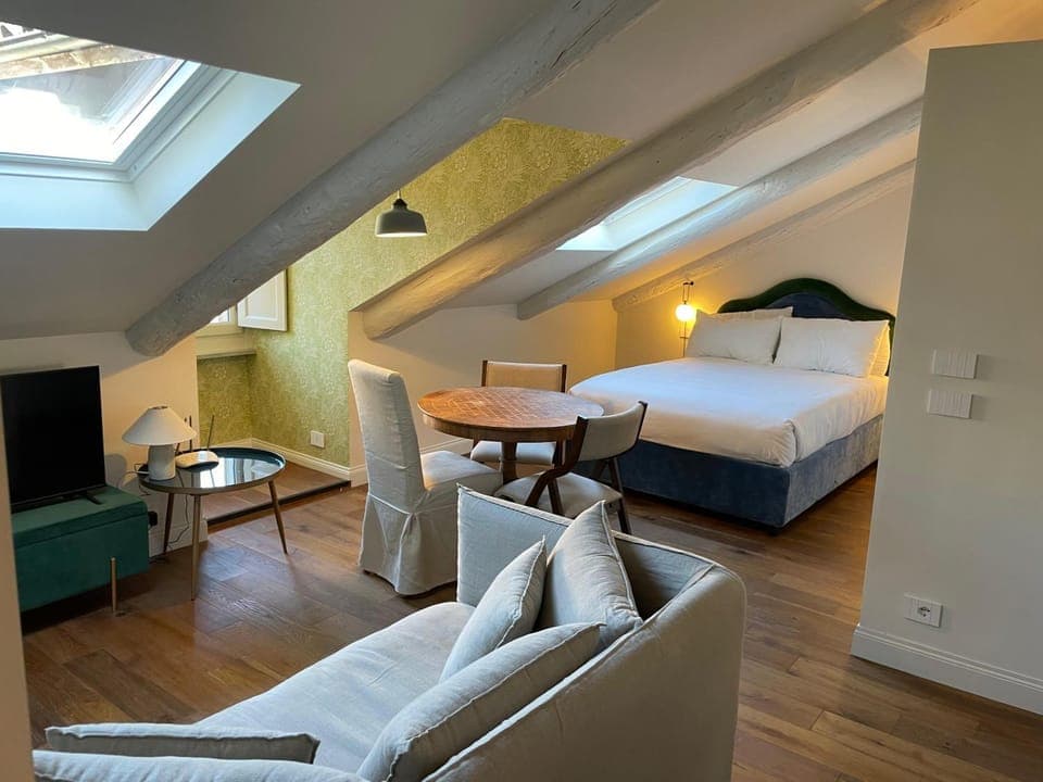 Bed, Living room, Seating area, Bedroom