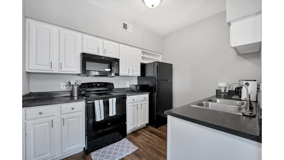 Kitchen or kitchenette, dishwasher, oven, stove, toaster