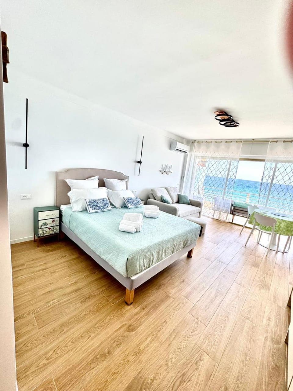 Bed, Natural landscape, Living room, Seating area, Bedroom, Sea view, towels