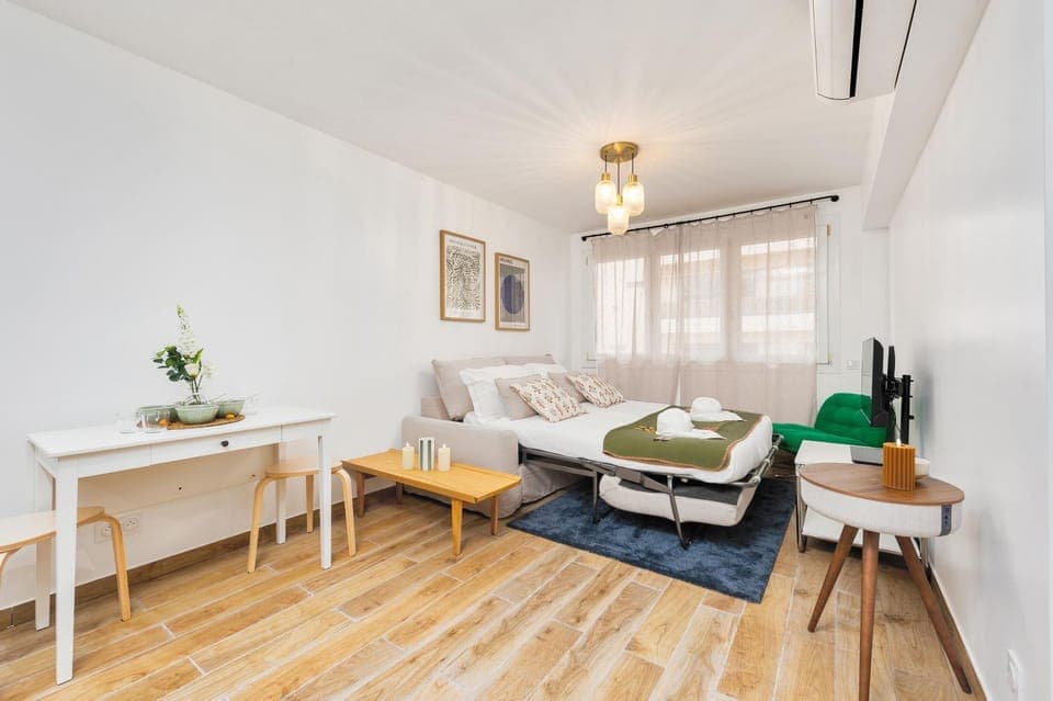 Bed, TV and multimedia, Living room, Seating area, air conditioner