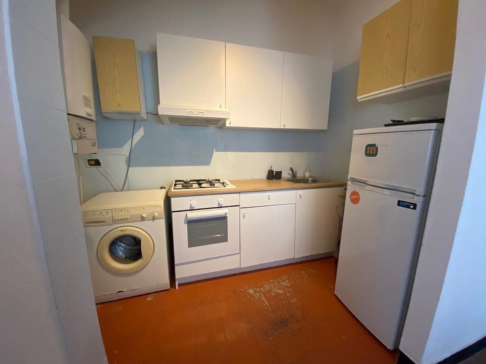 Kitchen or kitchenette, oven, stove, washing machine