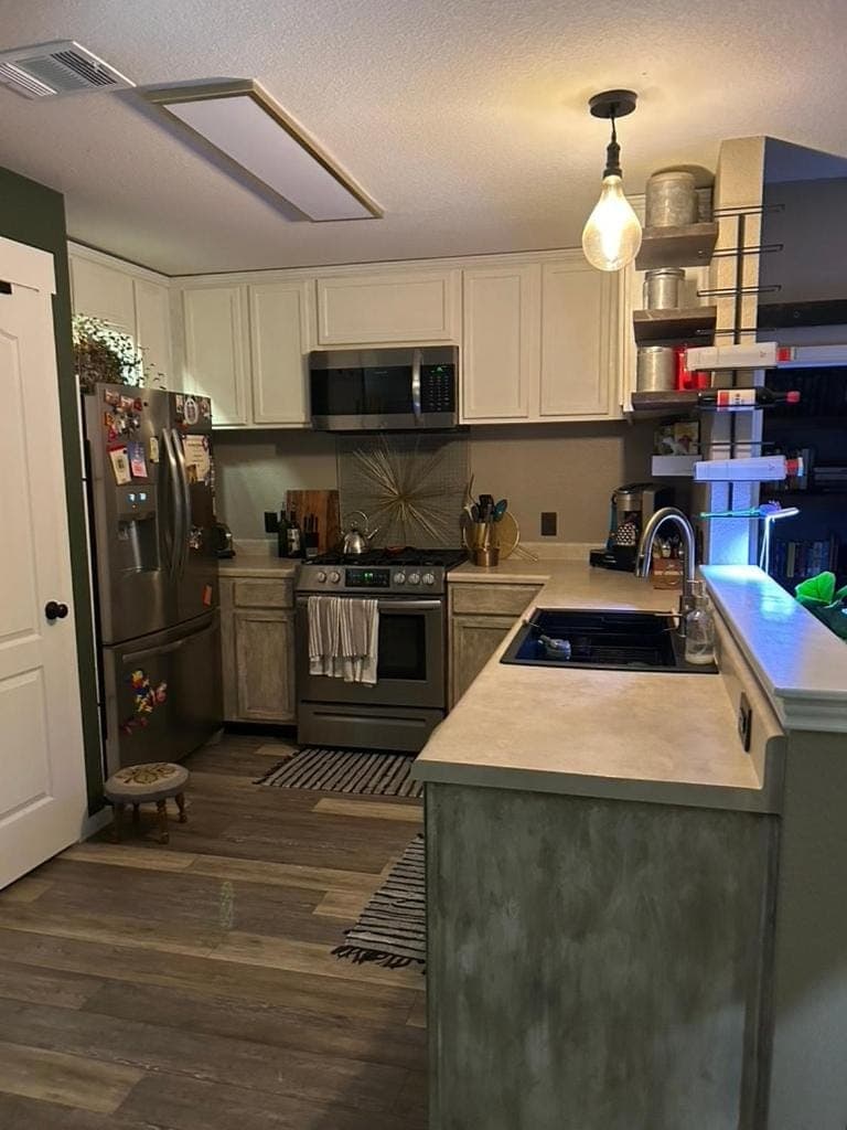 Kitchen or kitchenette, dishwasher, oven, stove