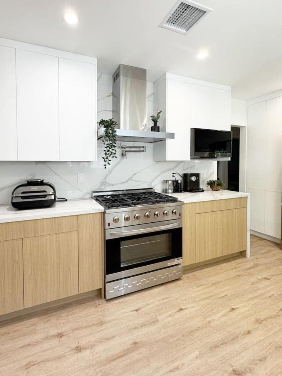 Kitchen or kitchenette, dishwasher, oven, stove, toaster