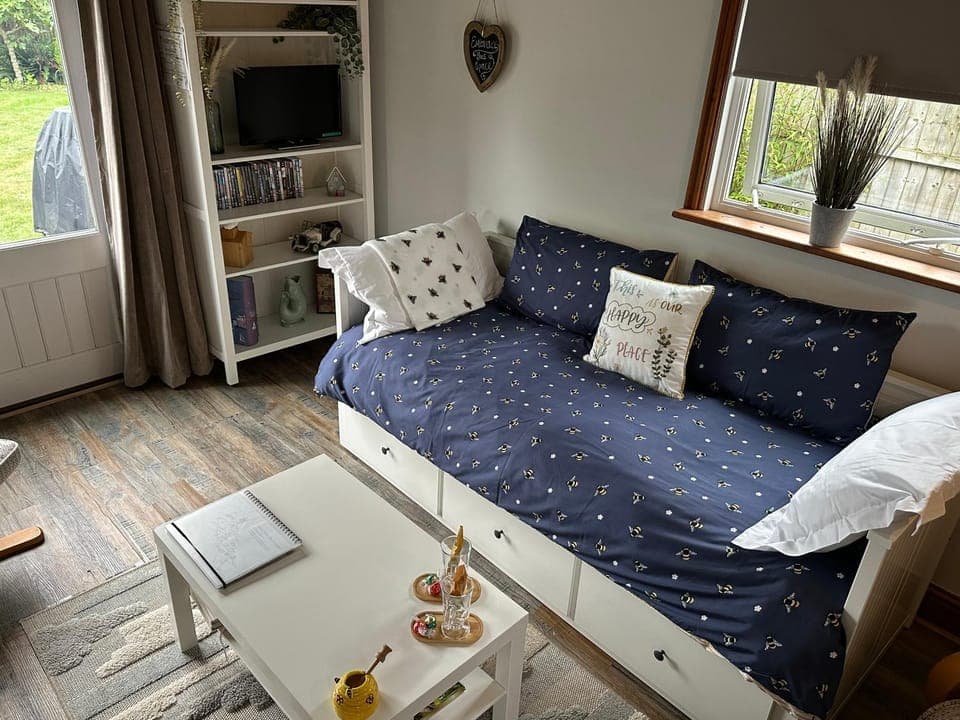 Bed, Living room, Seating area, Bedroom