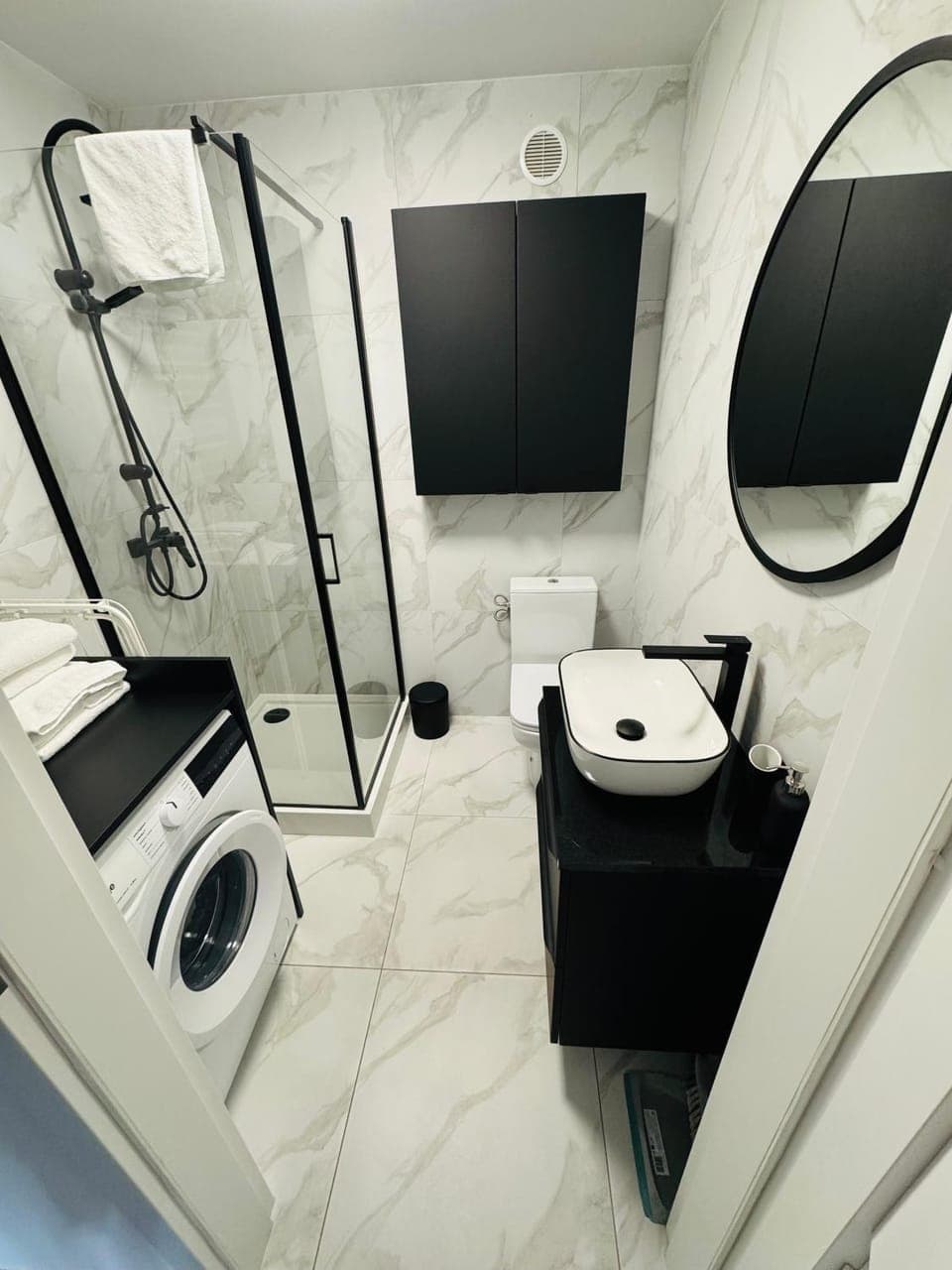 Shower, Toilet, Bathroom, towels, washing machine, dryer