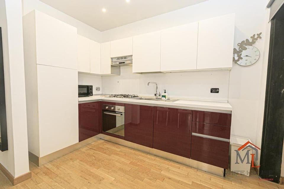 Kitchen or kitchenette, dishwasher, oven, stove