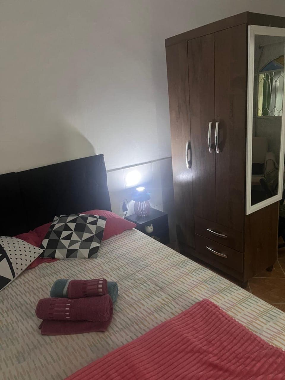 Bed, towels, wardrobe