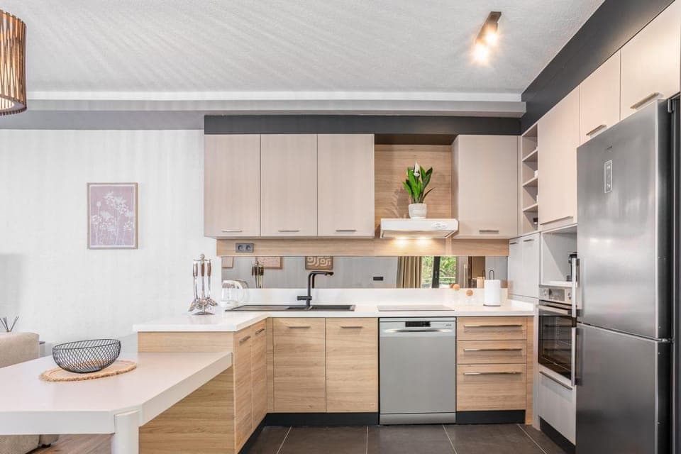 Kitchen or kitchenette, dishwasher, oven, stove