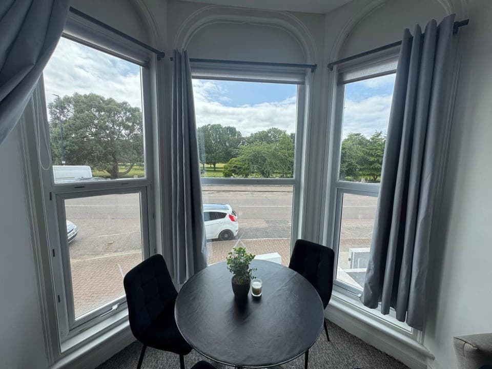 View (from property/room), Living room, Seating area, Dining area