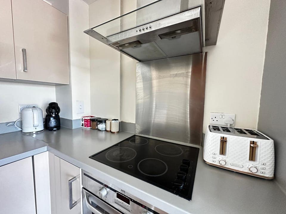 Kitchen or kitchenette, oven, stove, toaster