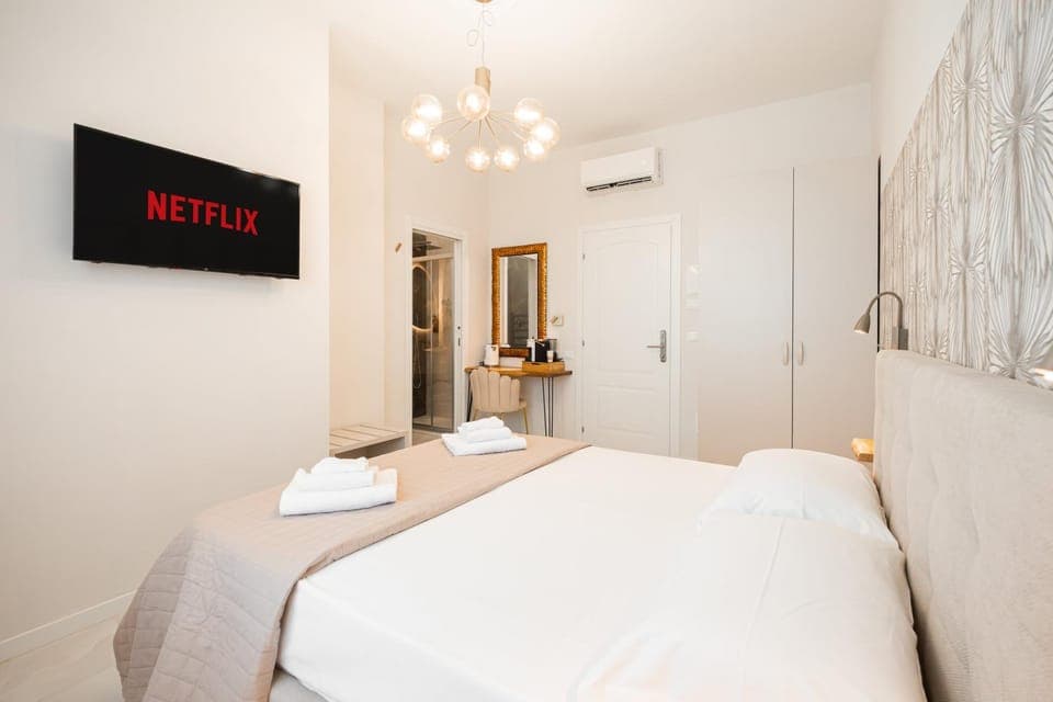 Bed, Photo of the whole room, Bedroom, towels, air conditioner