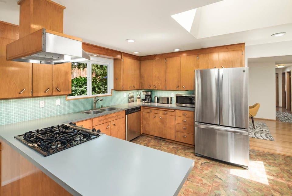 Kitchen or kitchenette, dishwasher, oven, stove