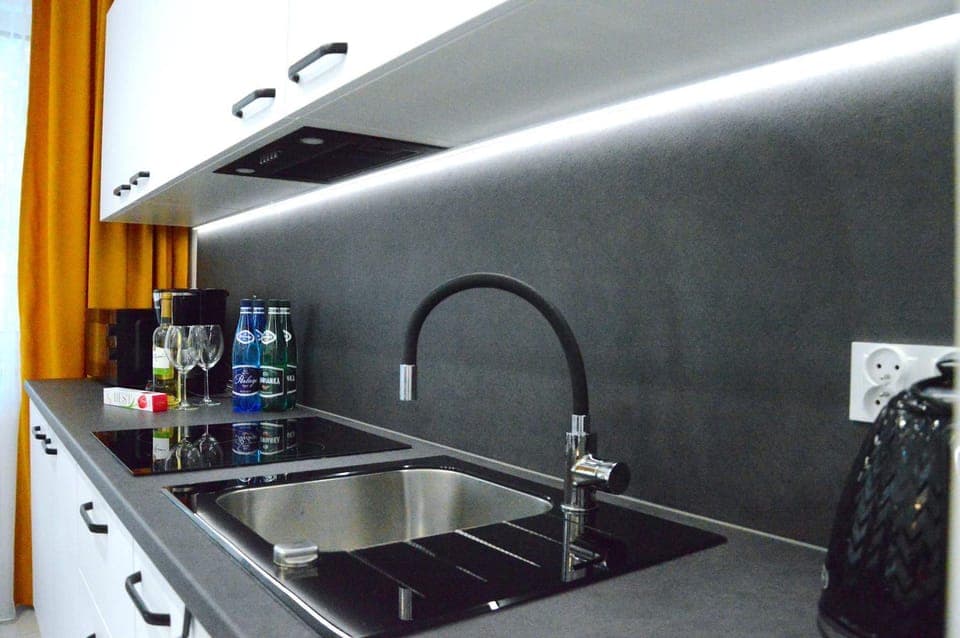 Kitchen or kitchenette, dishwasher, microwave, oven, stove