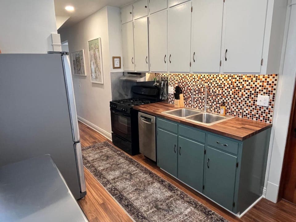 Kitchen or kitchenette, dishwasher, oven, stove