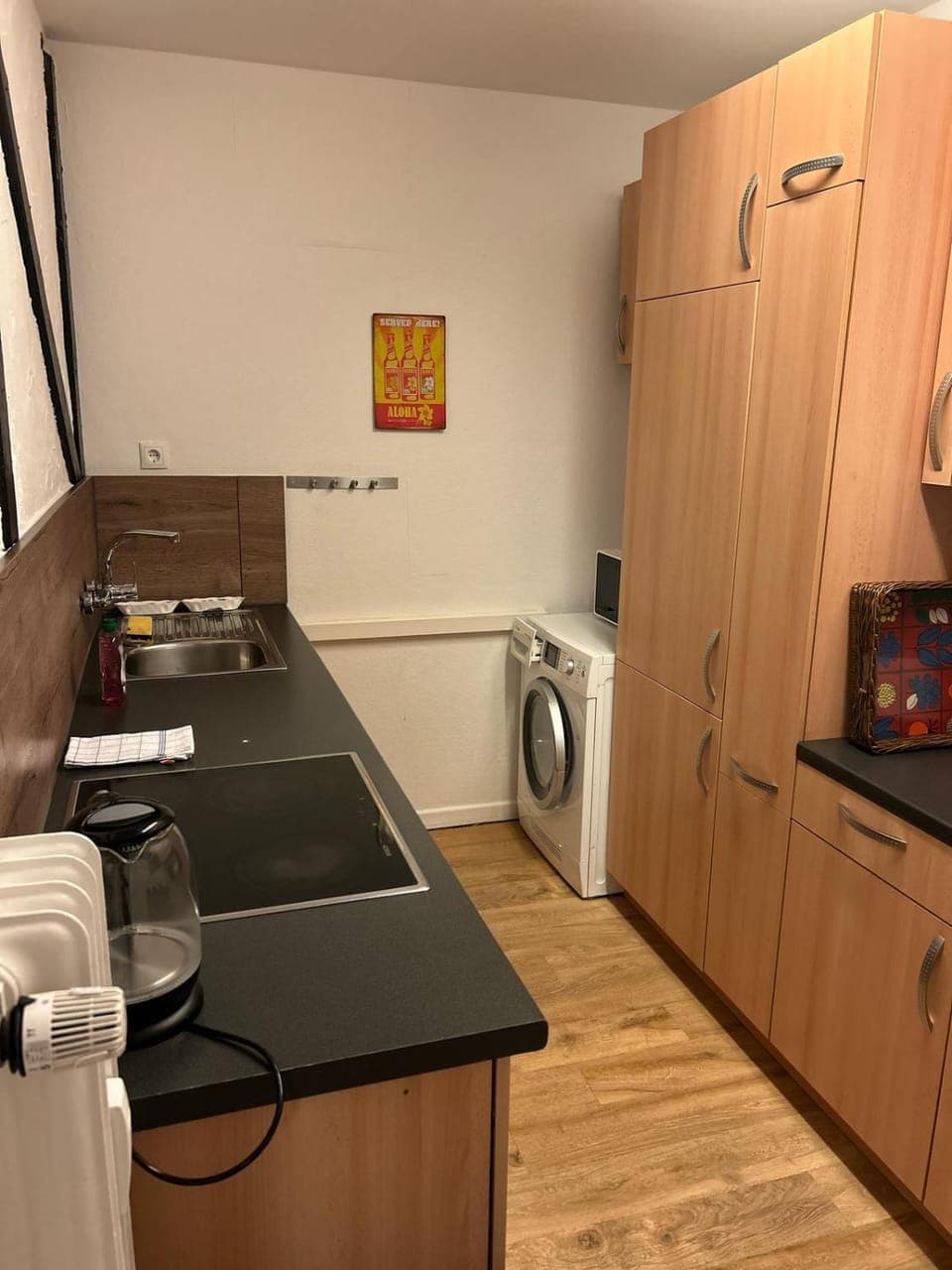 Kitchen or kitchenette, dishwasher, oven, stove, toaster, washing machine, dryer