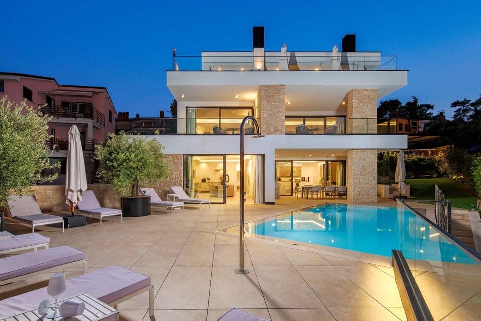 Property building, Patio, Night, Seating area, Pool view, Swimming pool, sunbed