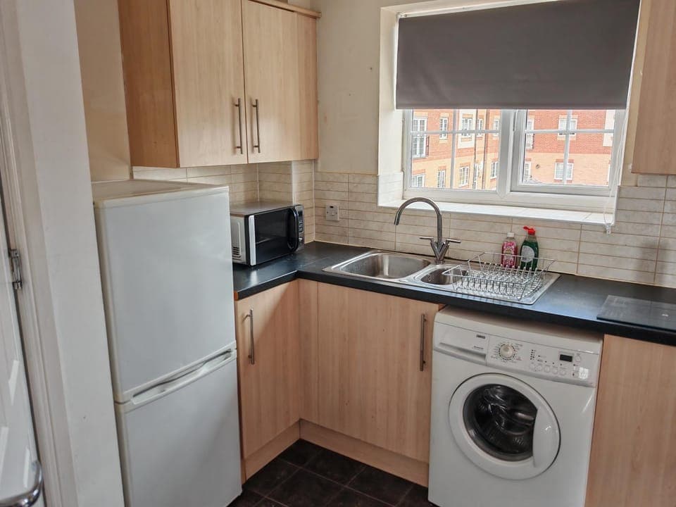 Kitchen or kitchenette, washing machine