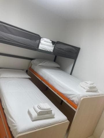 Bed, Photo of the whole room, Bedroom, bunk bed, towels