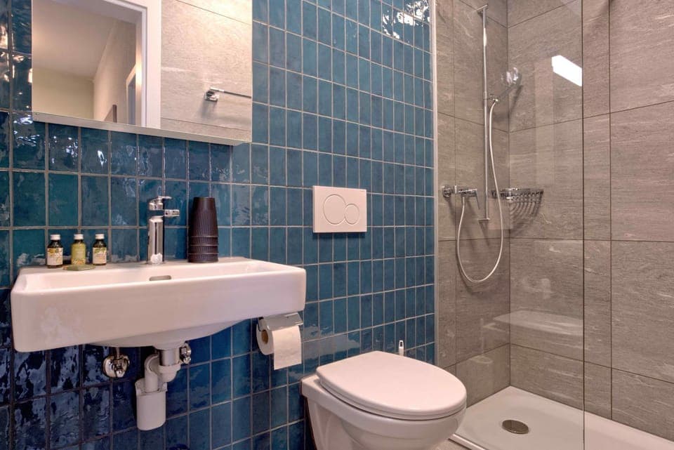 Shower, Toilet, Bathroom, hair dryier, towels