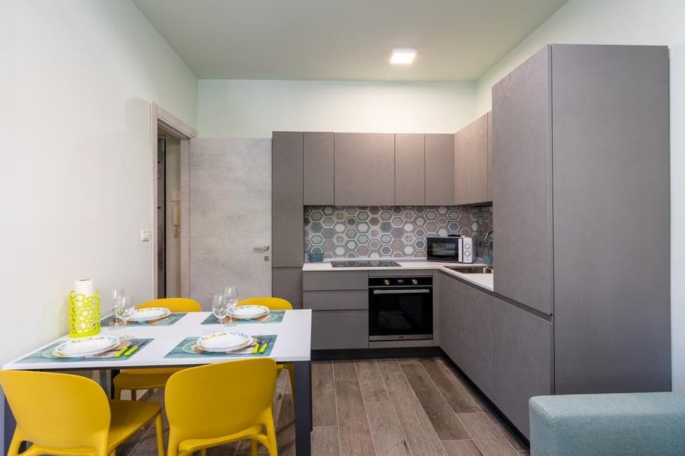 Kitchen or kitchenette, dishwasher, oven, stove