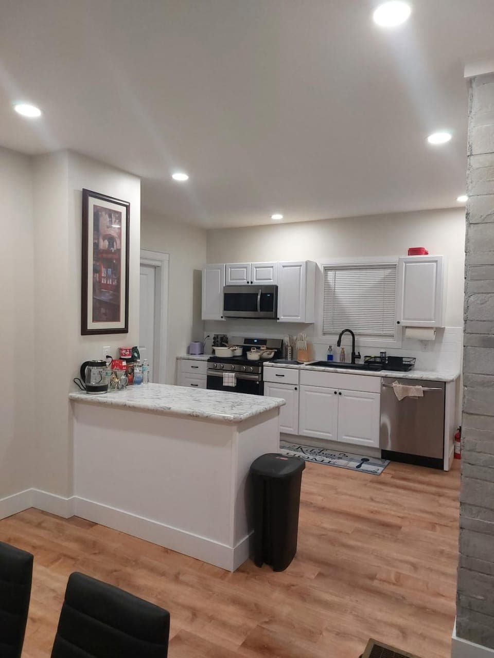 Kitchen or kitchenette, dishwasher, oven, stove, toaster