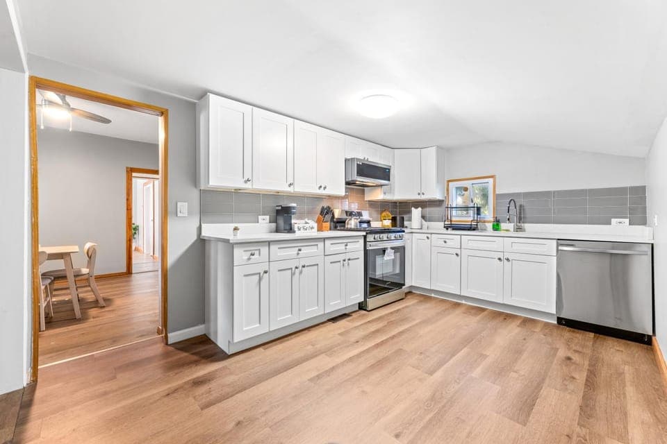 Kitchen or kitchenette, dishwasher, oven, stove, toaster