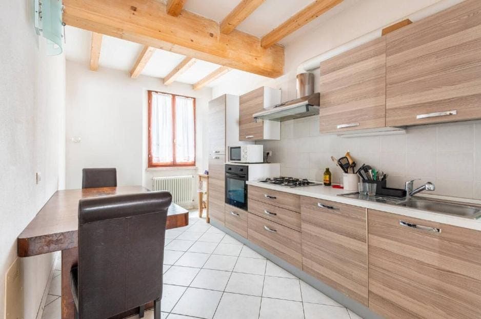 Kitchen or kitchenette, dishwasher, oven, stove