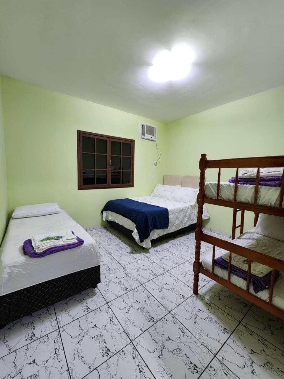 Bed, Photo of the whole room, bunk bed, towels, air conditioner