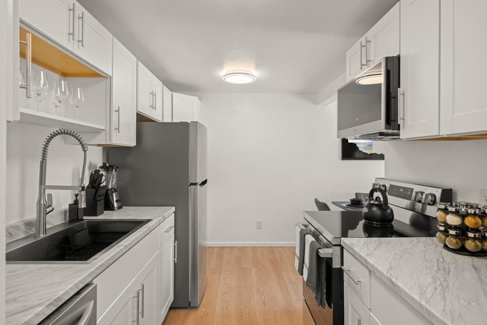 Kitchen or kitchenette, dishwasher, oven, stove