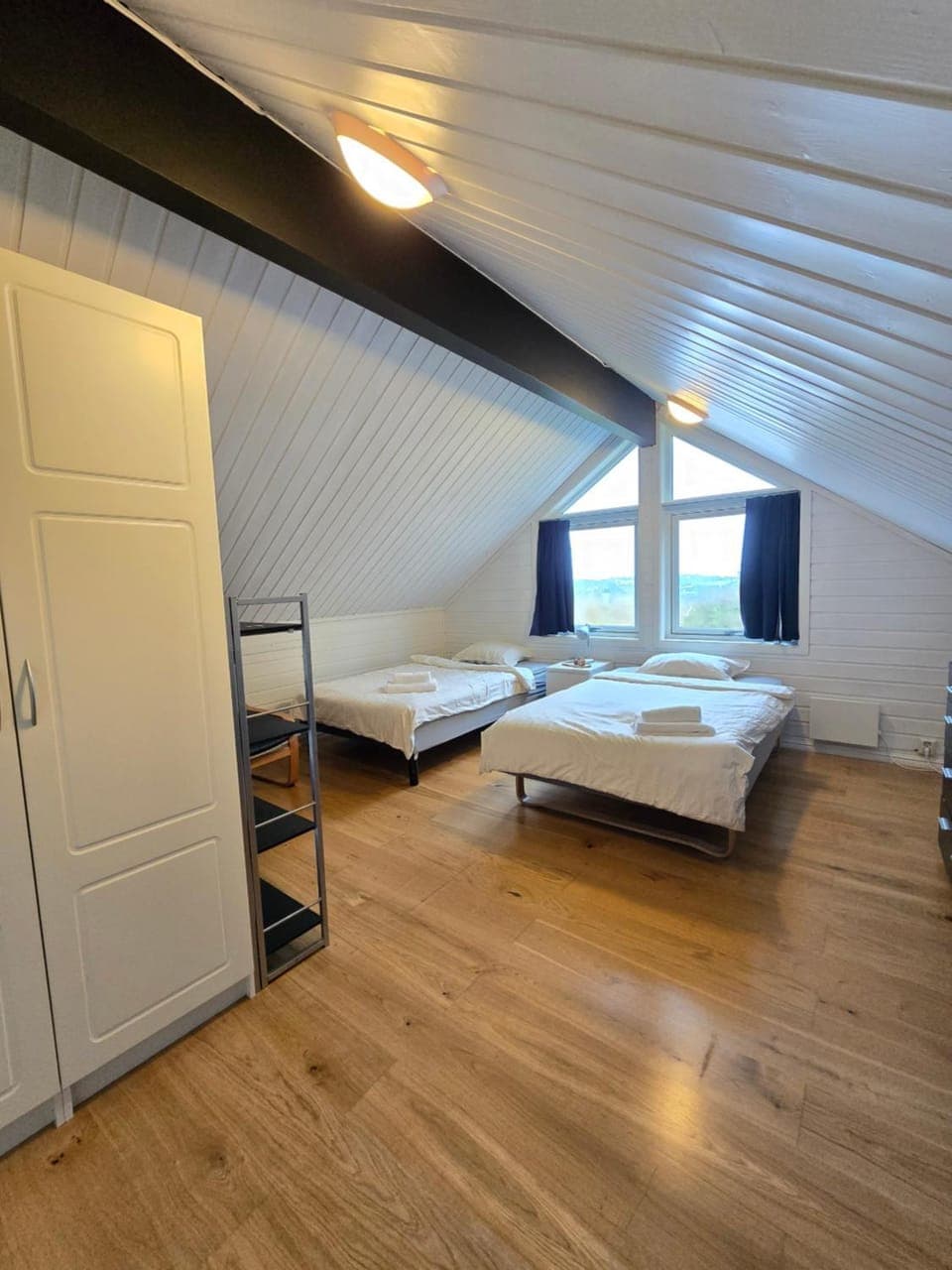 Bed, towels, wardrobe