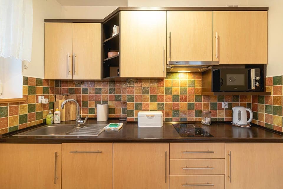 Kitchen or kitchenette, microwave, oven, stove, kitchen