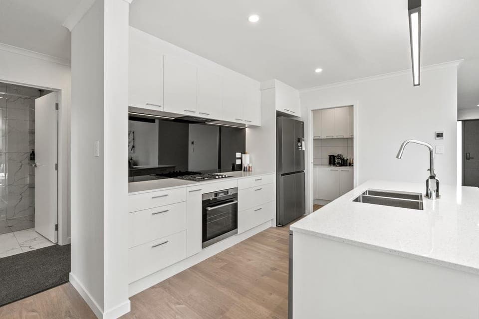 Kitchen or kitchenette, dishwasher, oven, stove