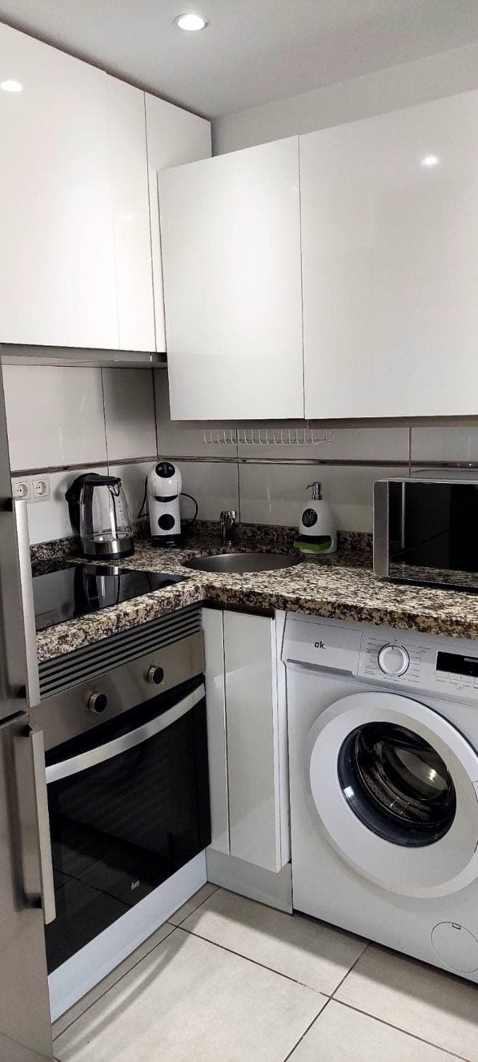 Kitchen or kitchenette, toaster, washing machine