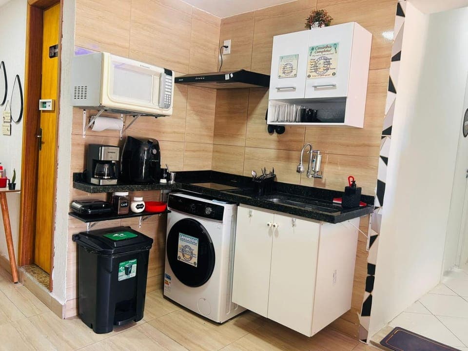 Kitchen or kitchenette, oven, stove, toaster, washing machine