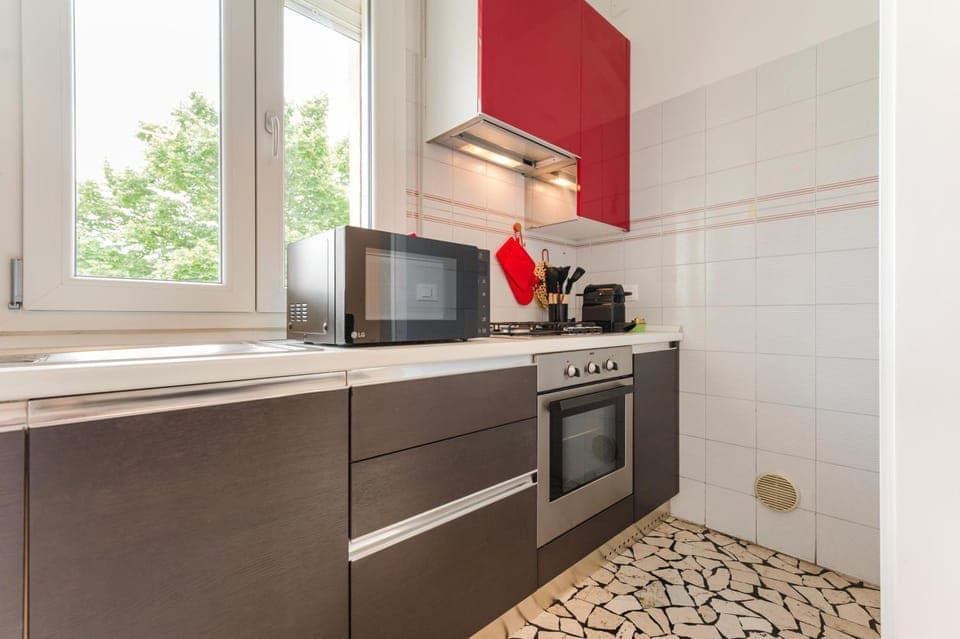 Kitchen or kitchenette, dishwasher, oven, stove